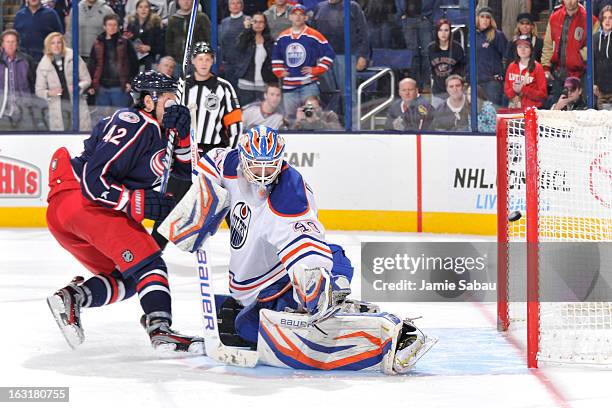 Artem Anisimov of the Columbus Blue Jackets scores on goaltender Devan Dubnyk of the Edmonton Oilers in the shootout on March 5, 2013 at Nationwide...