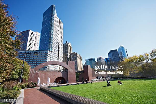 lower manhattan skyline seen from battery park - battery park stock pictures, royalty-free photos & images