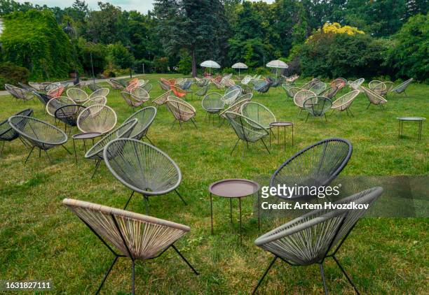 emty egg chairs on green grass. summertime - bubble chair stock-fotos und bilder