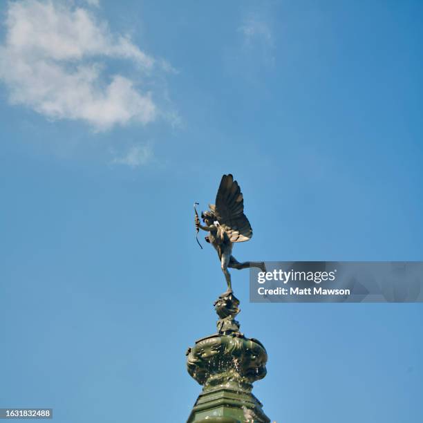 the statue of eros in piccadilly circus central london england uk - archery bow stock pictures, royalty-free photos & images