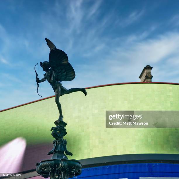 the statue of eros in piccadilly circus central london england uk - archery bow stock pictures, royalty-free photos & images