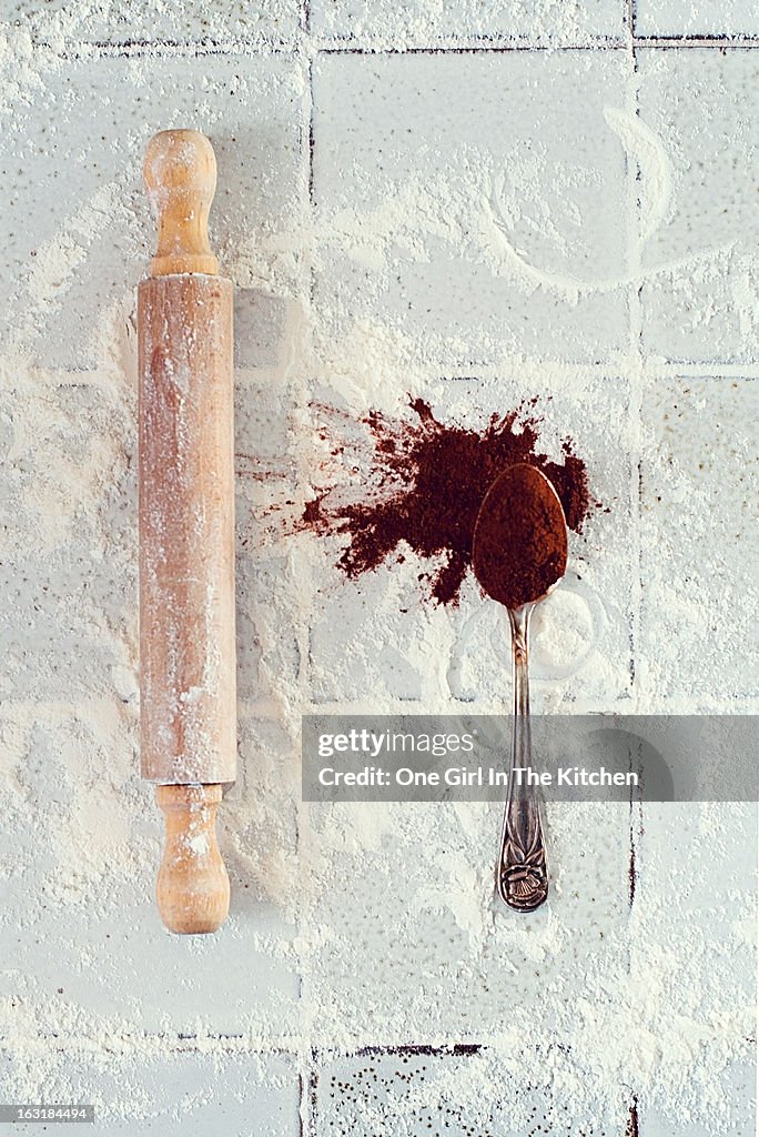 Rolling pin, teaspoon, flour and cocoa