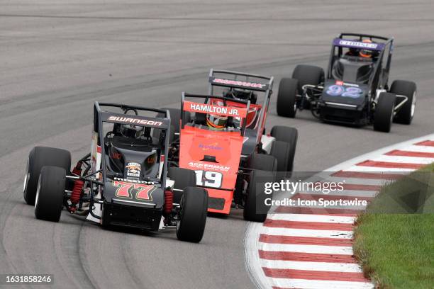 Kody Swanson and Davey Hamilton Jr. Race in turn four during the USAC Silver Crown Series Outfront 100 on August 27 at World Wide Technology Raceway...