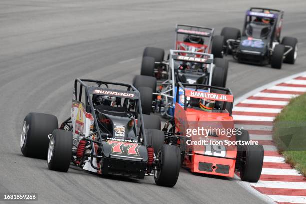 Davey Hamilton Jr. Looks under Kody Swanson for the lead in turn four during the USAC Silver Crown Series Outfront 100 on August 27 at World Wide...