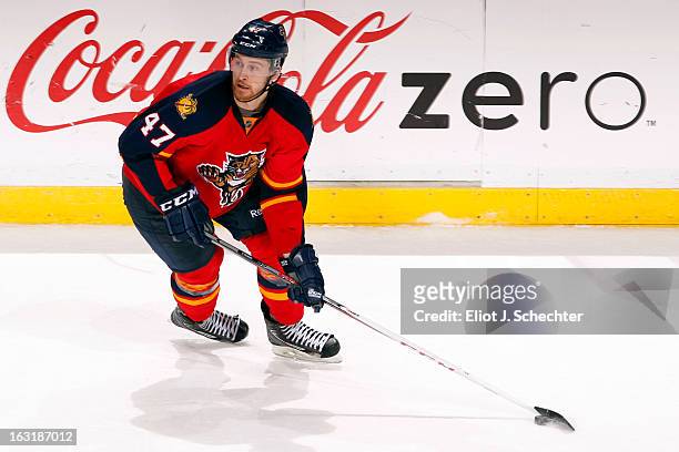 Colby Robak of the Florida Panthers skates with the puck against the Carolina Hurricanes at the BB&T Center on March 3, 2013 in Sunrise, Florida.