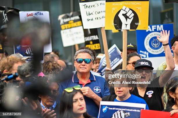 Member union representatives join members and supporters of the WGA and SAG-AFTRA on the picket line outside HBO and Amazon during a National Day of...