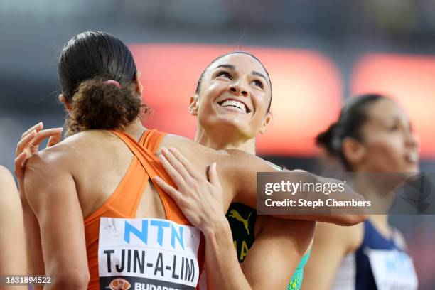 Maayke Tjin-A-Lim of Team Netherlands and Michelle Jenneke of Team Australia react after competing in the w100 during day four of the World Athletics...