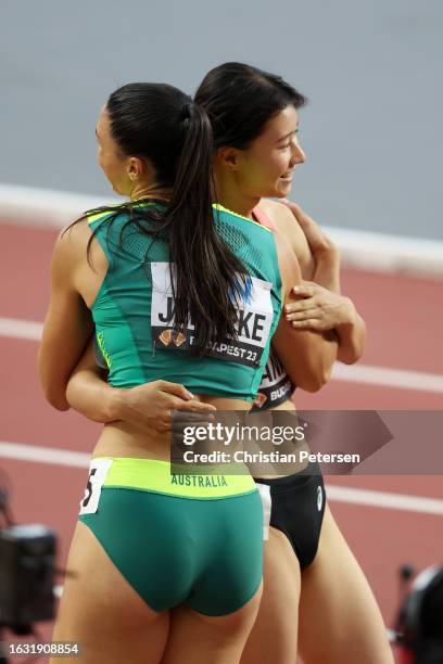 Michelle Jenneke of Team Australia and Yumi Tanaka of Team Japan react after competing in the Women's 100m Hurdles Heats during day four of the World...
