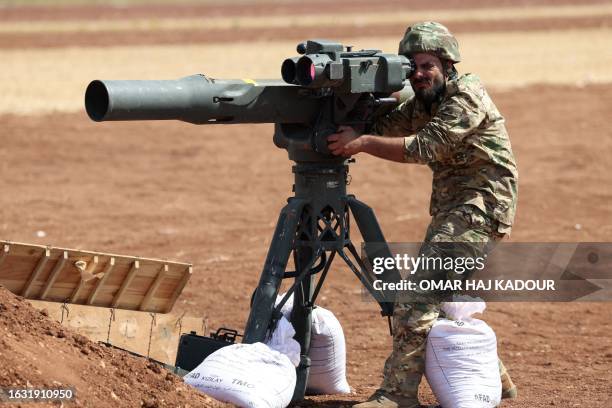 Turkey-backed Syrian fighter takes part in a military training near the town of Marea, in the rebel-controlled northern part of Syria's Aleppo...