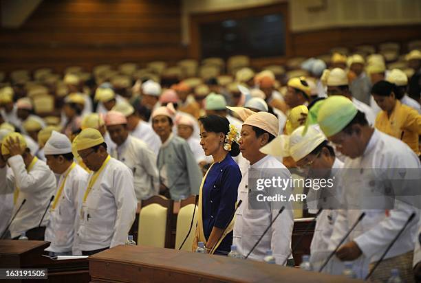 Myanmar's opposition leader Aung San Suu Kyi attends a session of the lower house of the parliament in the capital Naypyidaw on March 6, 2013. Aung...