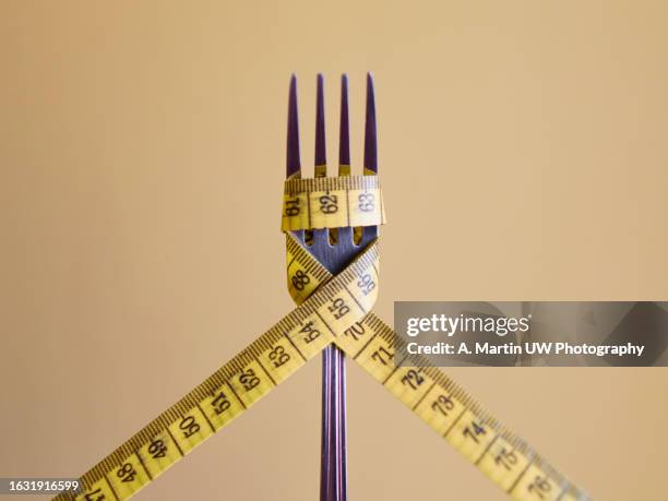 fork with tape measure - meter length stock pictures, royalty-free photos & images