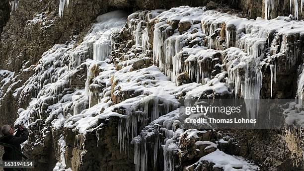 Visitor takes photographs of the winter ice in the Breitachklamm Canyon at Tiefenbach near Oberstorf on March 5, 2013 in Oberstdorf, Germany. The...
