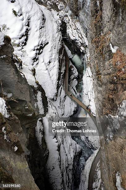 Visitors walks over a bridge in the Breitachklamm Canyon at Tiefenbach near Oberstorf on March 5, 2013 in Oberstdorf, Germany. The remarkable nature...