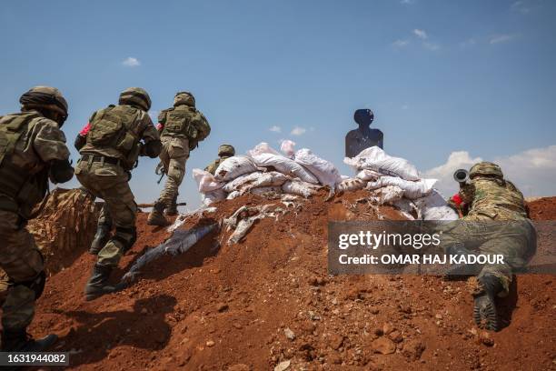 Turkey-backed Syrian fighters take part in a military training near the town of Marea, in the rebel-controlled northern part of Syria's Aleppo...