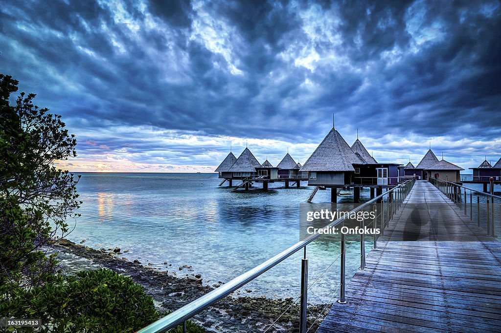 Tropical Paradise Luxury Over Water Resort at Sunset