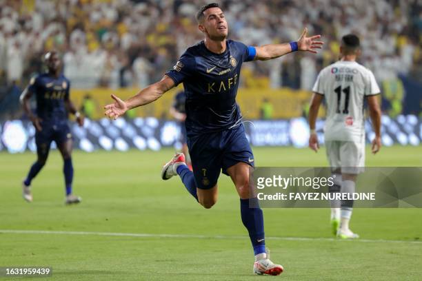 Nassr's Portuguese forward Cristiano Ronaldo celebrates his goal during the Saudi Pro League football match between Al-Nassr and Al-Shabab in...