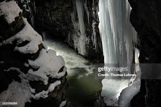 Water surrounds the ice covered rocks and stones in the Breitachklamm Canyon at Tiefenbach near Oberstorf on March 5, 2013 in Oberstdorf, Germany....