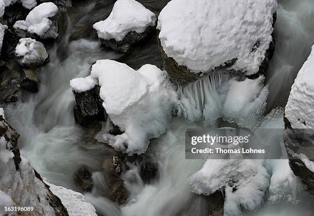 Water freezes as it surrounds the ice covered rocks and stones in the Breitachklamm Canyon at Tiefenbach near Oberstorf on March 5, 2013 in...
