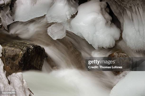 Water rushes around the ice covered rocks and stones in the Breitachklamm Canyon at Tiefenbach near Oberstorf on March 5, 2013 in Oberstdorf,...