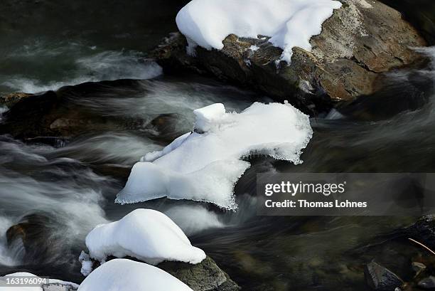 Water rushes through the ice covered rocks and stones in the Breitachklamm Canyon at Tiefenbach near Oberstorf on March 5, 2013 in Oberstdorf,...