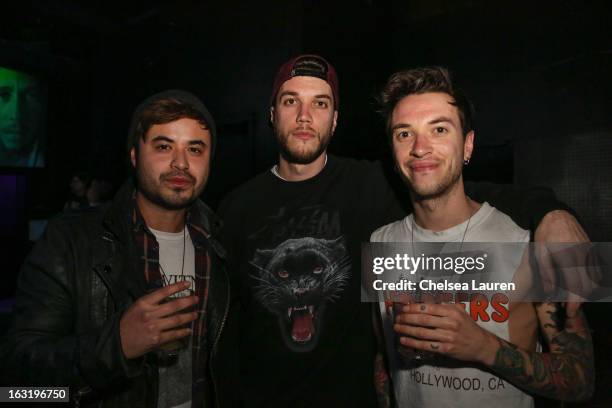 Bassist Simon Mitchell, guitarist John Taylor and guitarist Fraser Taylor of Young Guns pose backstage at Key Club on March 5, 2013 in West...