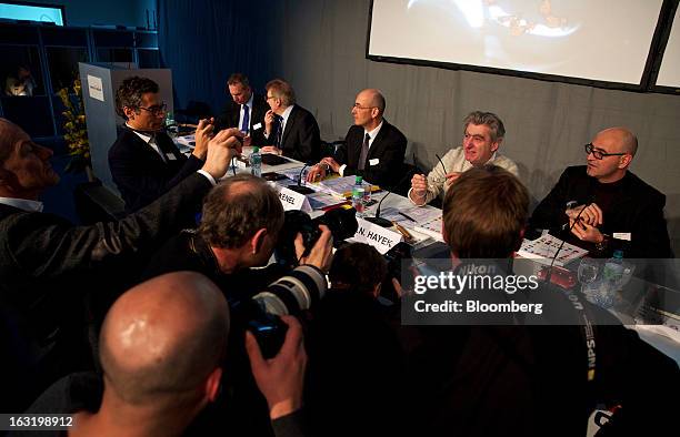 Nick Hayek, chief executive officer of Swatch AG, second right, poses for photographers during the company's annual results news conference in...