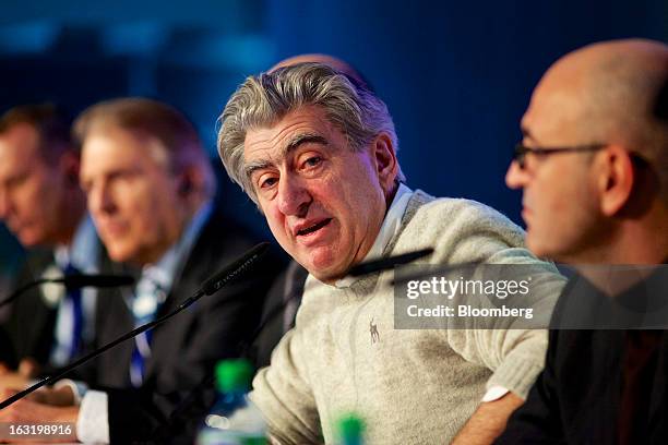 Nick Hayek, chief executive officer of Swatch AG, center, speaks during the company's annual results news conference in Grenchen, Switzerland, on...