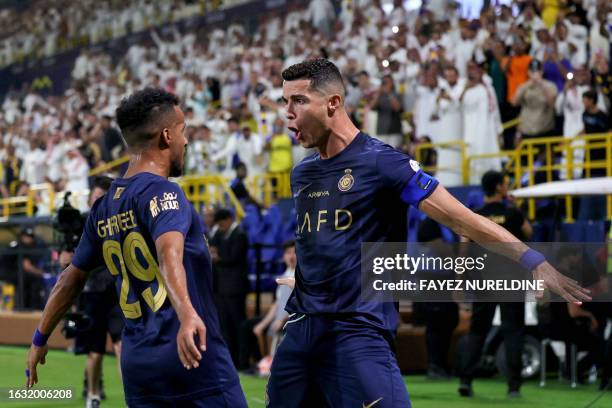 Nassr's Portuguese forward Cristiano Ronaldo celebrates his second goal during the Saudi Pro League football match between Al-Nassr and Al-Shabab in...