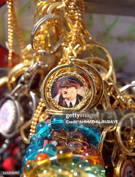 Key chain bearing the image of Adolf Hitler is displayed at a street vendor in the 300-year-old Souk al-Haraj in Midan Square in old Baghdad on March...