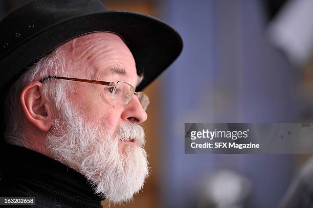 Portrait of English fantasy author Sir Terry Pratchett during a meeting with SFX Magazine/Future via Getty Images to promote his new book, The Long...