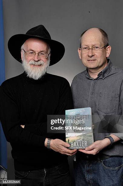 Portrait of British fantasy/science fiction authors Sir Terry Pratchett and Stephen Baxter promoting their book, The Long Earth, on May 16, 2012.