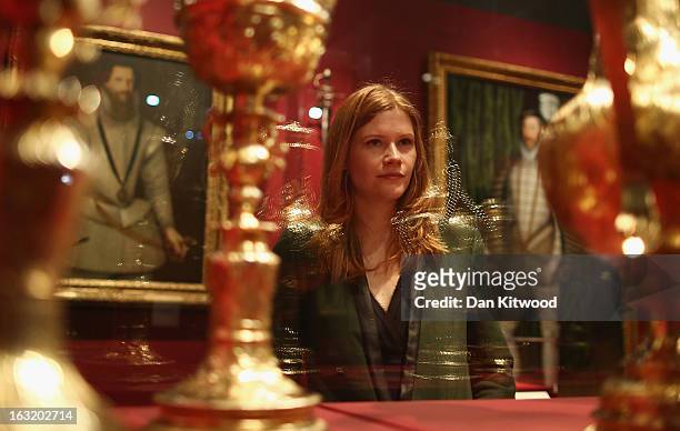 Visitor looks at gold pots, which form part of the historic collection of armoury during a press preview of the V&A's new exhibit on March 6, 2013 in...