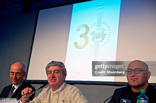 Thierry Kenel, chief financial officer of Swatch Group AG, left, and Marc Hayek, head of the Swatch Group AG's Blancpain brand, right, listen as Nick...