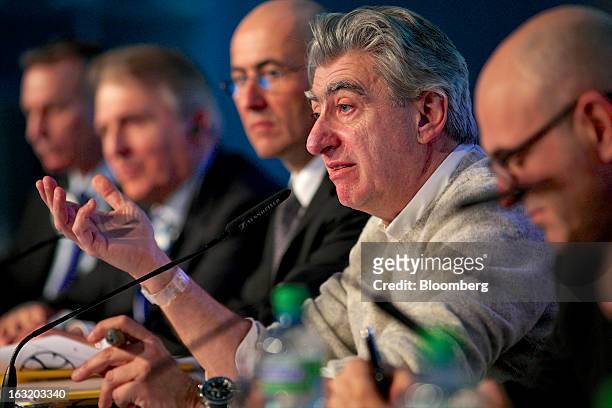 Nick Hayek, chief executive officer of Swatch Group AG, second right, gestures during the company's annual results news conference in Grenchen,...