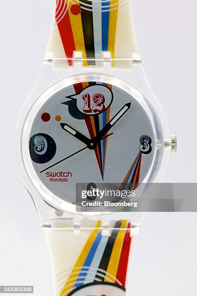 Swatch GE198 "Crazy Youngster" wristwatch, produced by Swatch Group AG, sits on display following the company's annual results news conference in...