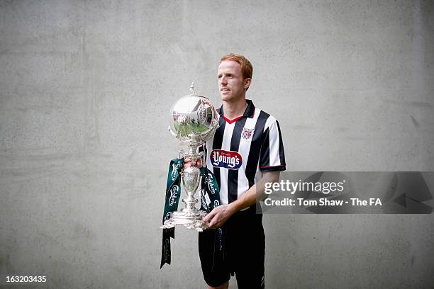 Craig Disley of Grimsby poses with the trophy during the FA Trophy Media day at Wembley Stadium on March 6, 2013 in London, England.