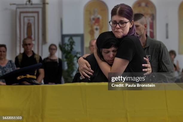 Lilia Averianova, mother of Andrii mourns the death of fighter pilot Andrii "Juice" Pilshchykov during his funeral on August 29, 2023 in Kyiv,...