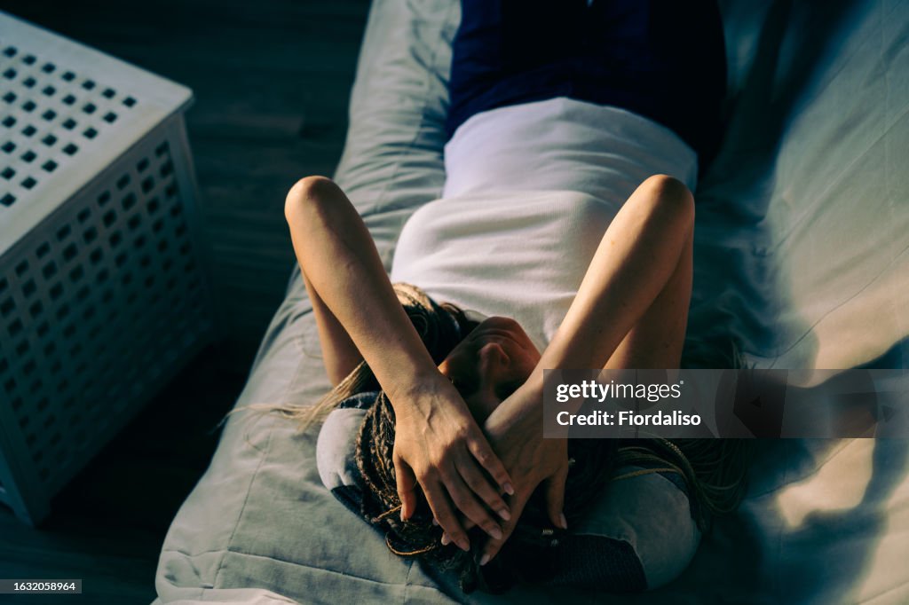 Portrait of a woman lying on the sofa