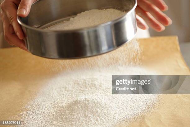 woman sieving flour,close up - sieve stock pictures, royalty-free photos & images