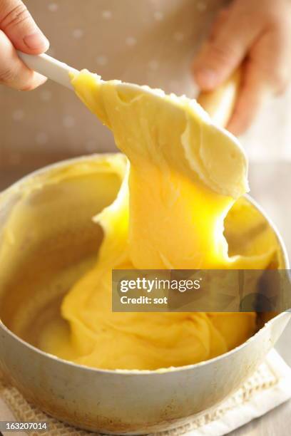 woman mixing custard cream,close up - カスタード ストックフォトと画像