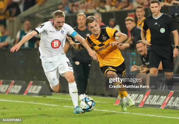 Tom Zimmerschied of Dresden challenges for the ball with Laurent Jans of Mannheim during the 3. Liga match between Dynamo Dresden and Waldhof...