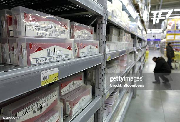 Cartons of Marlboro cigarettes sit for sale inside a Lenta LLC supermarket in Prokopyevsk, Kemerevo region, Russia, on Wednesday, March 6, 2013....