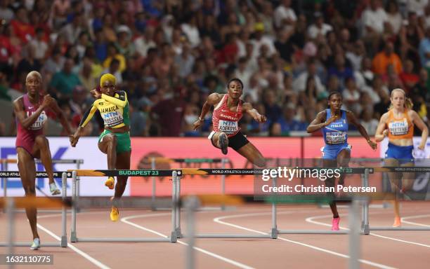 Janieve Russell of Team Jamaica and Kemi Adekoya of Team Bahrain compete in the Women's 400m Hurdles Semi-Final during day four of the World...