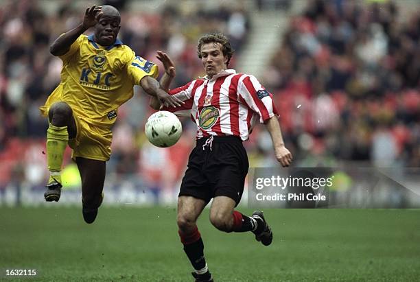 Michael Gray of Sunderland goes in for a 50/50 ball with Paul Hall of Portsmouth during a game between Sunderland and Portsmouth in the Nationwide...