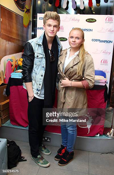 Cody Simpson and Alli Simpson meet fans and signs shoes at the Schuh store on Oxford Street on March 6, 2013 in London, England.