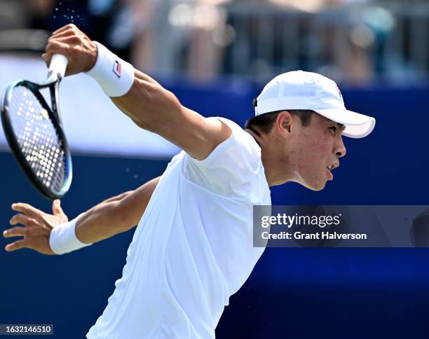 Brandon Nakashima of the United States returns a shot to Arthur Fils of France in the second round of the Winston-Salem Open at Wake Forest Tennis...