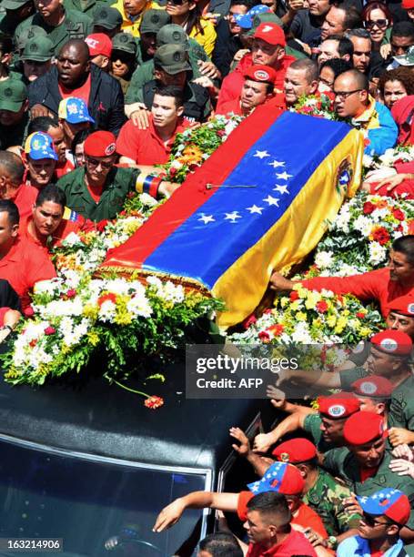 View of the hearse carrying the coffin of Venezuelan President Hugo Chavez while leaving the Military Hospital to the Military Academy, on March 6 in...