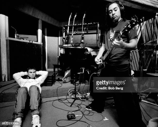 American Nu Metal music producer Ross Robinson relaxes as metal guitarist Ahrue Luster, of the American heavy metal band Machine Head, plays in...