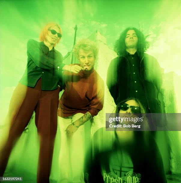 American musicians Brian Young, Joe Skyward , Jon Auer and Ken Stringfellow, of the American power pop group The Posies, pose for a group portrait in...