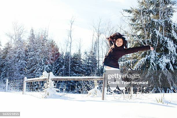 girl jumping in winter - collingwood ontario kanada bildbanksfoton och bilder